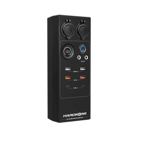 Large Hardkorr 12V DC power distribution box front view with covered sockets, a voltmeter and USB ports.