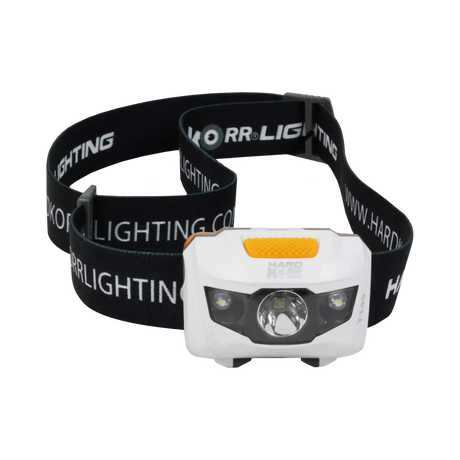 Hardkorr 145 lumen headtorch front view with a central reflector, two smaller lights and orange top button.