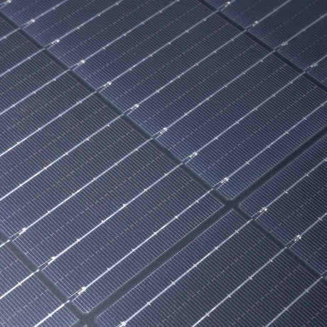 Hardkorr 200W 12V portable solar blanket solar cells in close up with fine silver lines and fabric joins.