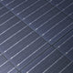 Hardkorr 200W 12V portable solar blanket solar cells in close up with fine silver lines and fabric joins.