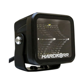 Hardkorr 20W XDW square LED work light front left view with a mounting bracket and side pivot bolt.