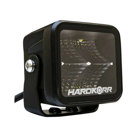 Hardkorr 20W XDW square LED work light front left view with a mounting bracket and side pivot bolt.