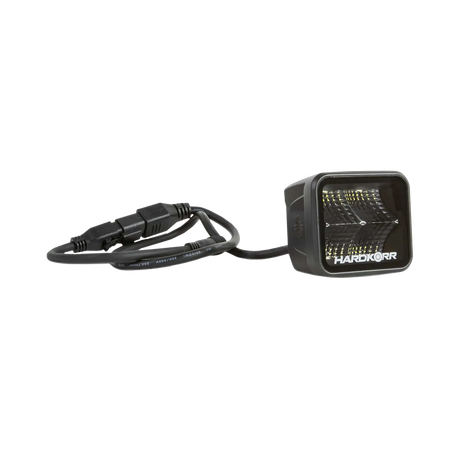 Hardkorr 20W XDW square LED work light angled view with the cable and inline connector laid beside it.