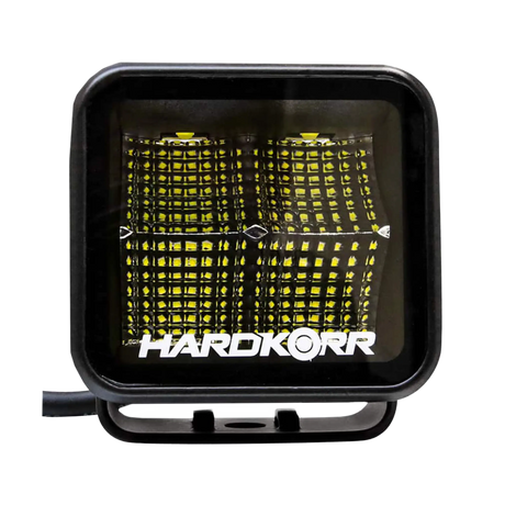 Hardkorr 20W XDW square LED work light front close up with four reflector sections and a slotted mounting bracket.