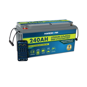 Hardkorr 240Ah 12V lithium battery beside a phone displaying the Bluetooth monitoring app.