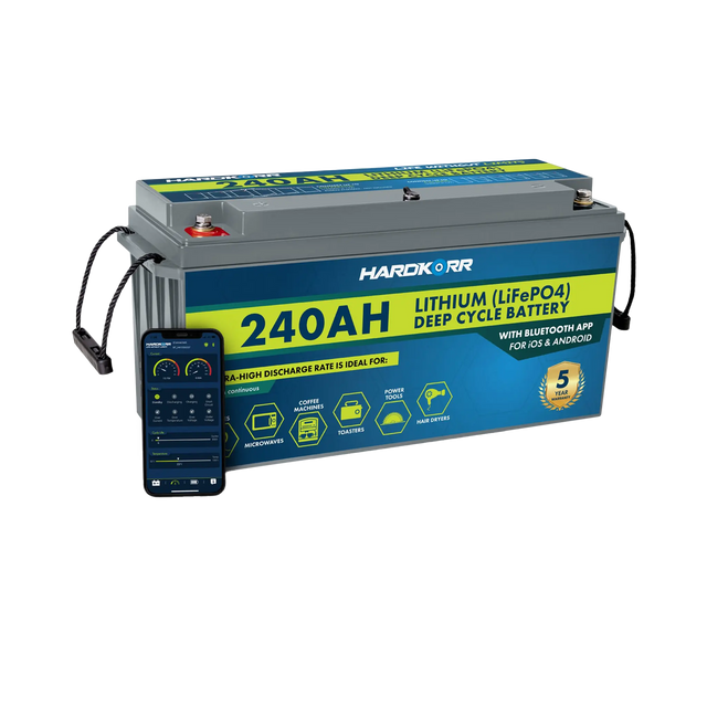 Hardkorr 240Ah 12V lithium battery beside a phone displaying the Bluetooth monitoring app.