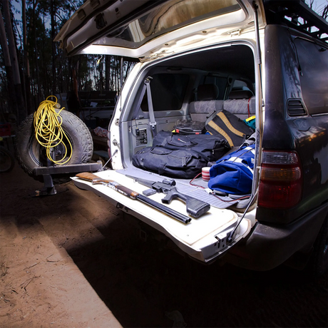 Hardkorr 2m LED tape light close up around a rear hatch, lighting the cargo area and tailgate in white.