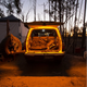Hardkorr 2m LED tape light casting orange light over a vehicle's open rear cargo area and the ground.
