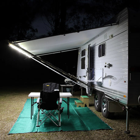 Hardkorr 5m white flexible LED tape light along a caravan awning edge, viewed from beside the caravan.