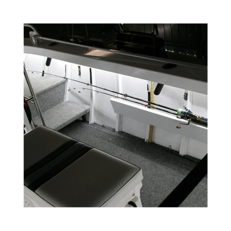 Hardkorr 8m Tri-Colour LED boat lights beneath the side rail, illuminating fishing rod storage in white.