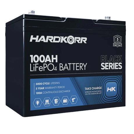 Hardkorr Black 100Ah 12V lithium battery front-left view with label and top terminals.
