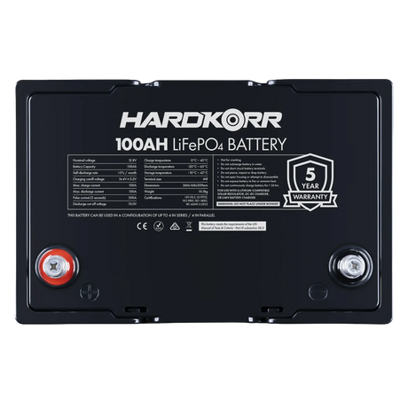 Hardkorr Black 100Ah 12V lithium battery top view with specification label and terminals.