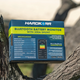 Hardkorr Bluetooth battery monitor box resting in a tree fork with rear specifications and a phone app illustration.
