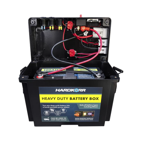 Black Hardkorr battery box open with a battery installed and positive and negative wiring visible beneath the lid.