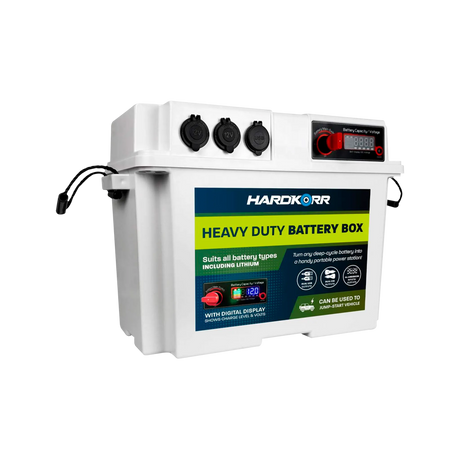 White Hardkorr battery box front left view with covered sockets, a red control knob and carrying handles.
