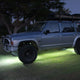 Hardkorr High Powered Rock Lights illuminating the ground beneath a parked Nissan Patrol.