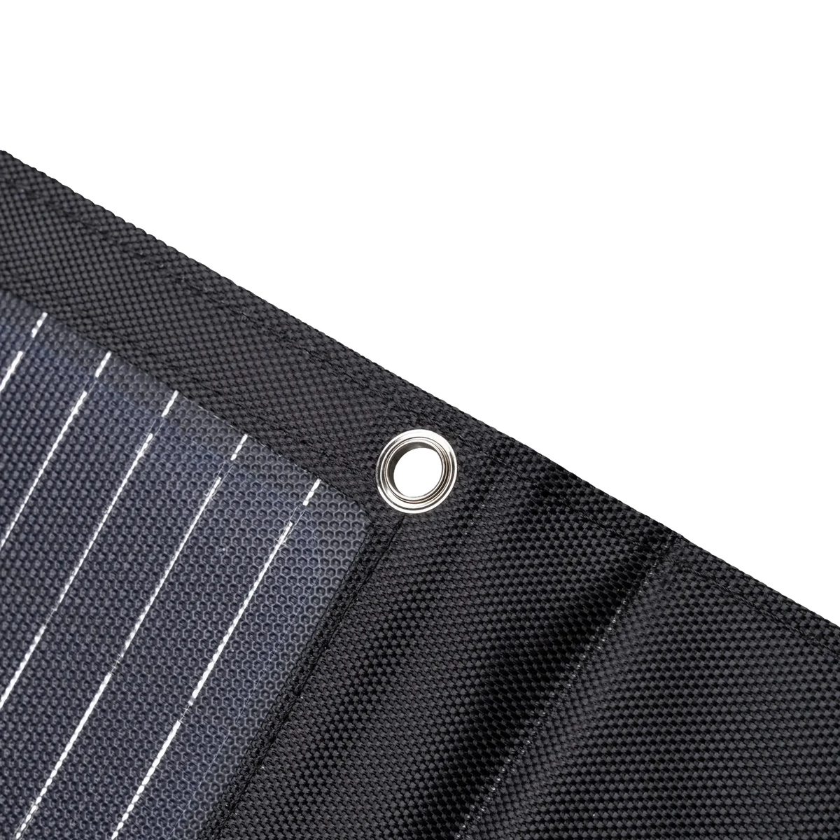 Hardkorr MKII 200W solar mat corner close up with a metal eyelet beside the solar cells.