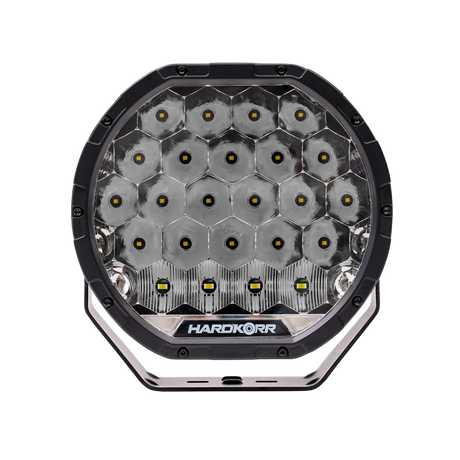 Single Hardkorr XD Series 9 inch LED driving light straight front view with LED reflectors and lower mounting slots.