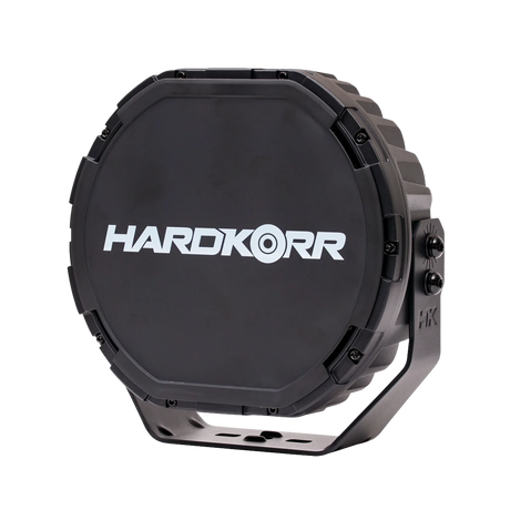 Single Hardkorr XD Series 9 inch LED driving light front right view with its black Hardkorr cover fitted.