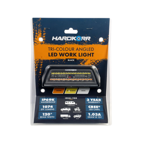 Hardkorr XDW angled tri colour LED work light in retail packaging with the lamp visible below its product label.