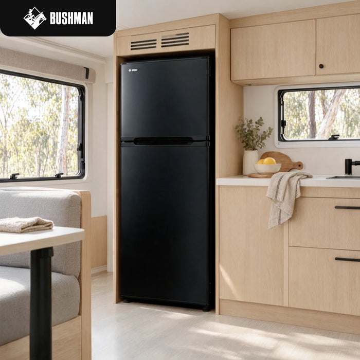 Bushman black two-door upright fridge in a caravan kitchen