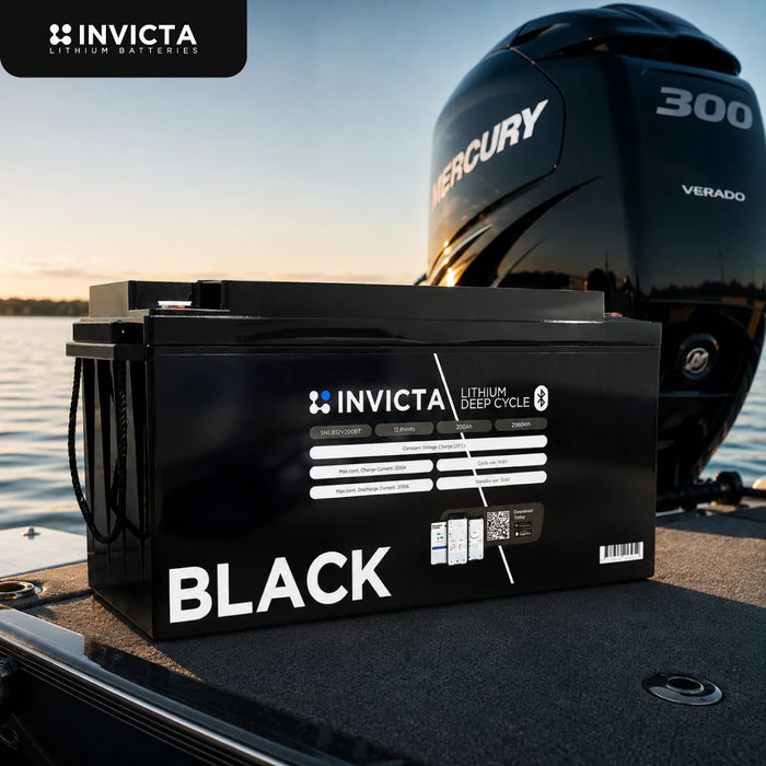 Invicta Black 200Ah lithium battery on a boat deck beside an outboard motor