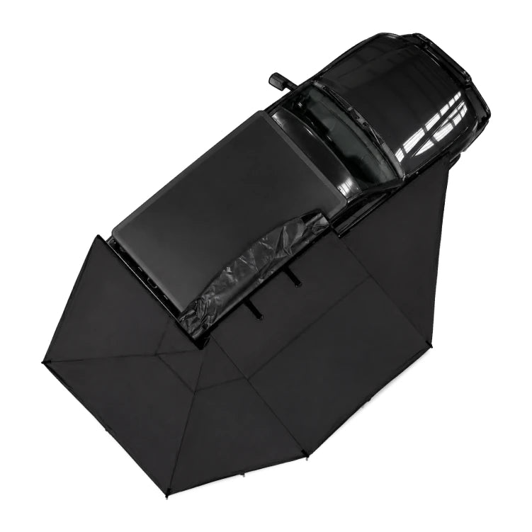 Black awning opened out from a 4WD, seen from above