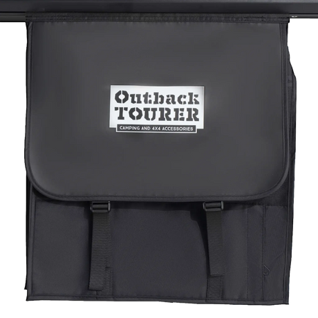 Outback Tourer 1.2 X Rooftop Tent hanging storage bag with Outback Tourer logo on it.