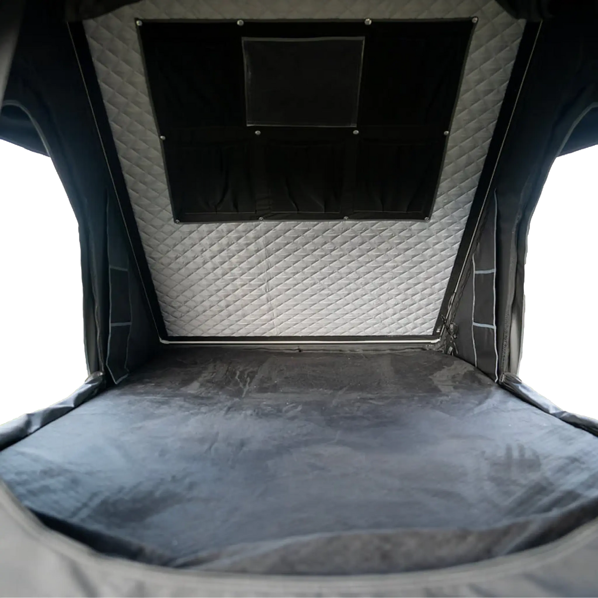 Outback Tourer 1.4 Rooftop Tent interior view with mattress and hanging storage pocket.