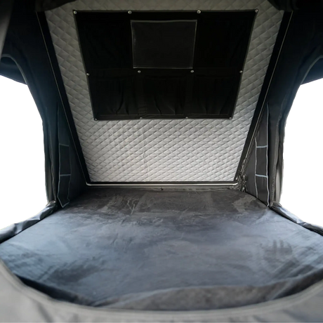 Outback Tourer 1.4 Rooftop Tent interior view with mattress and hanging storage pocket.