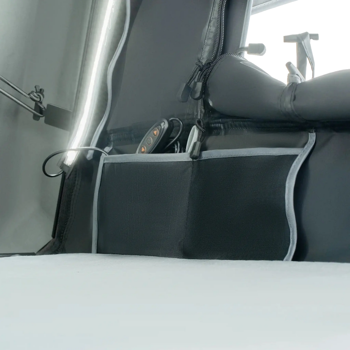Outback Tourer 1.5 Lite Rooftop Tent interior organiser pocket beside the mattress.