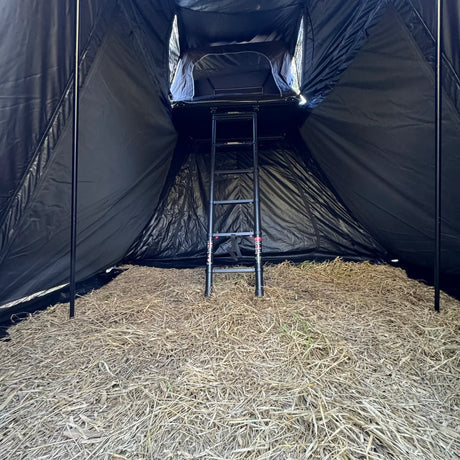 Outback Tourer 1.5 Pro Annex close interior view with ladder and rooftop tent opening.