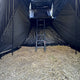 Outback Tourer 1.5 Pro Annex close interior view with ladder and rooftop tent opening.