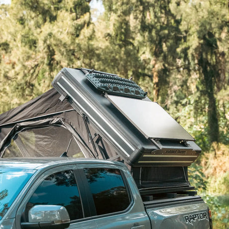 Outback Tourer 1.5 Pro Rooftop Tent front open view with roof rack on a grey ute.