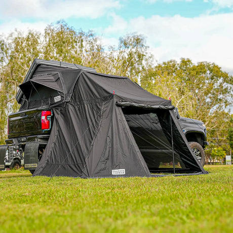 Outback Tourer 1.9 Pro Annex front left view attached below the rooftop tent.