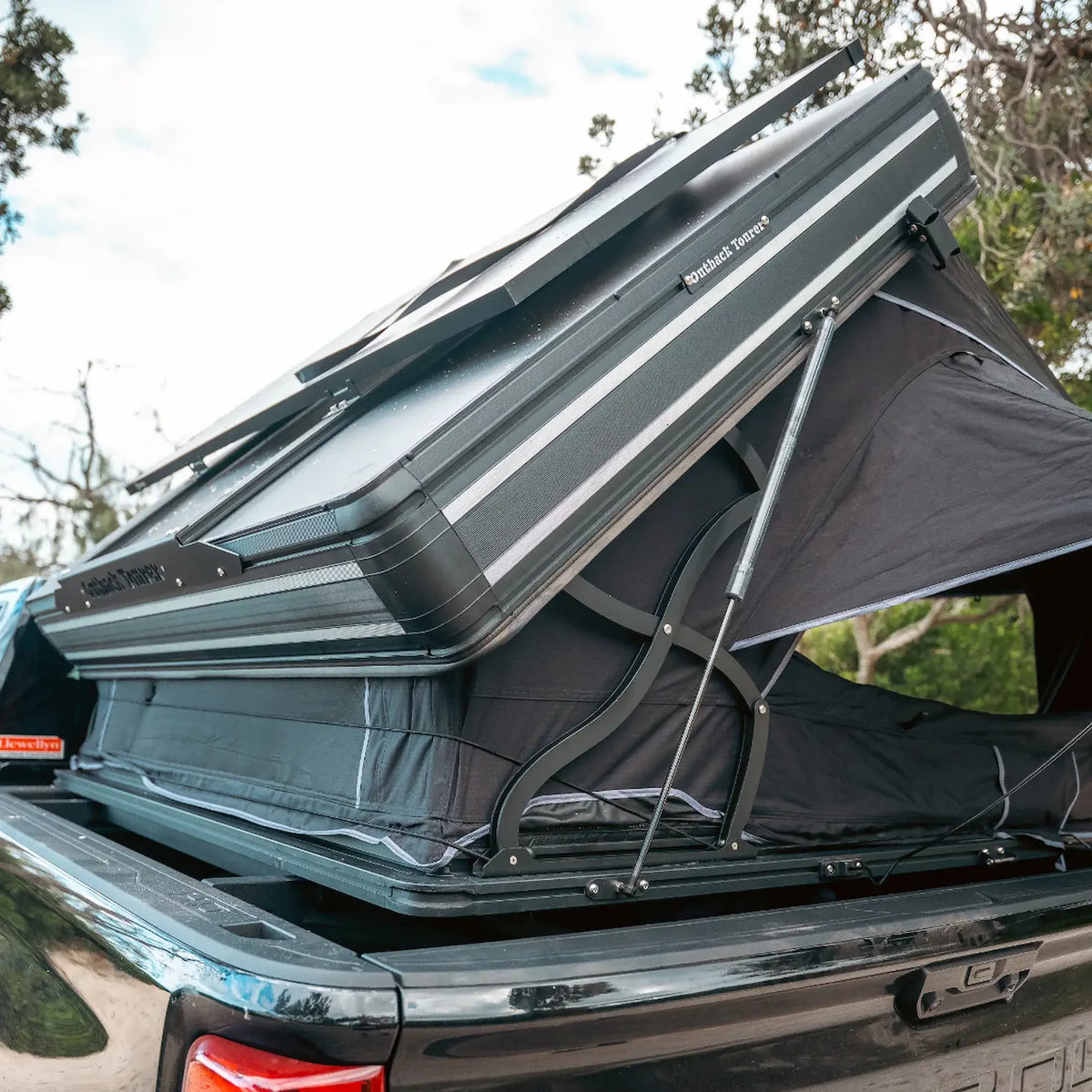 Outback Tourer 1.9 Pro Rooftop Tent hinge strut detail on the open shell.