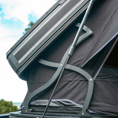 Outback Tourer 1.9 Pro Rooftop Tent hinge and bracket detail under the open shell.