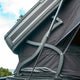 Outback Tourer 1.9 Pro Rooftop Tent hinge and bracket detail under the open shell.