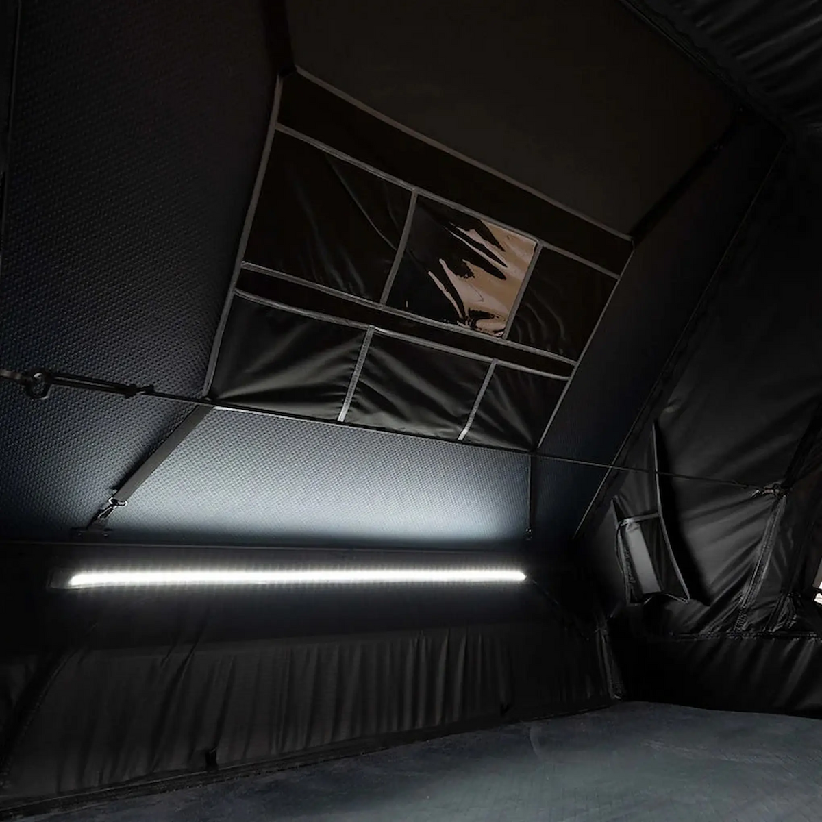 Outback Tourer 1.9 Pro Rooftop Tent interior light strip above the bed area.