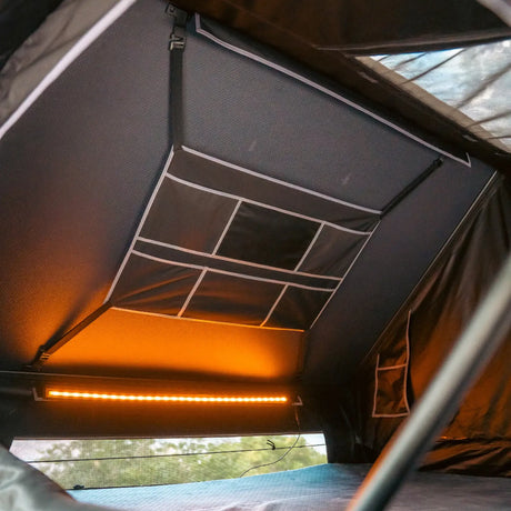 Outback Tourer 1.9 Pro Rooftop Tent interior organiser pockets above the bed area.