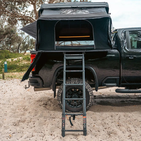 Outback Tourer 1.9 Pro Rooftop Tent rear ladder view mounted on a black ute.