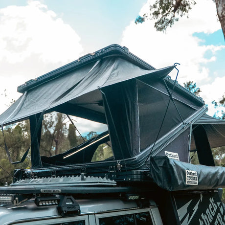Outback Tourer 1550 Z Rooftop Tent open front right installed above the vehicles canopy.