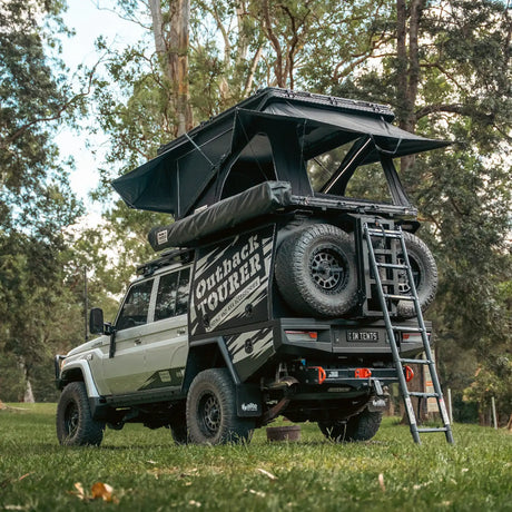 Outback Tourer 1550 Z Rooftop Tent rear installed view with ladder leaning on the canopy of the ute.