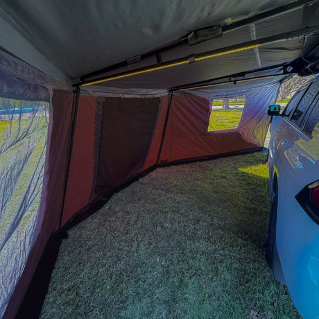 Outback Tourer 180 Full Wall Kit interior view around a vehicle with mesh windows and roof frame.