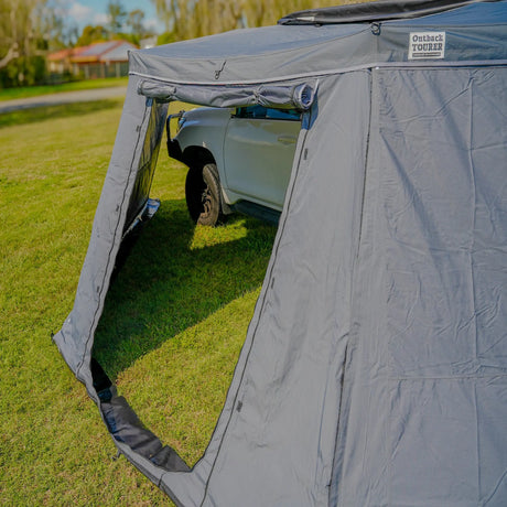 Outback Tourer 180 Full Wall Kit side doorway open beside a parked vehicle.