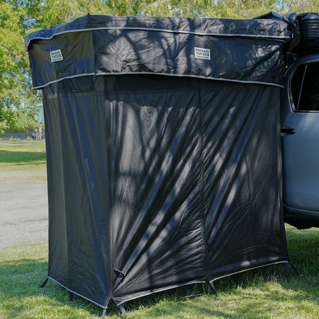 Outback Tourer Double Shower Awning front view with black fabric walls and zippered entry.