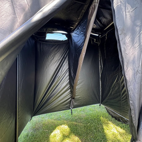 Outback Tourer Double Shower Awning interior with support pole, black walls and mesh door.