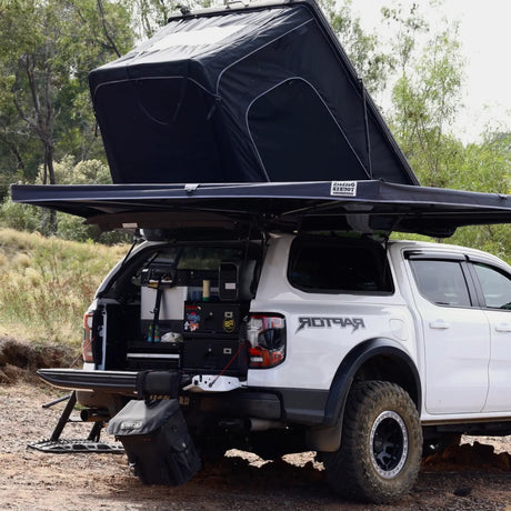 Outback Tourer Drivers Side 270 Awning back corner view with rooftop tent on a white ute.