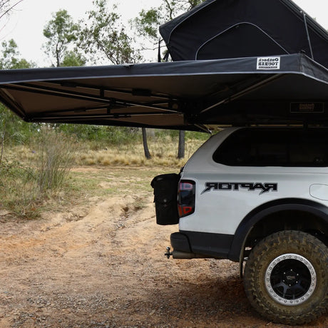 Outback Tourer Drivers Side 270 Awning side installed view on a white ute beside a dirt track.