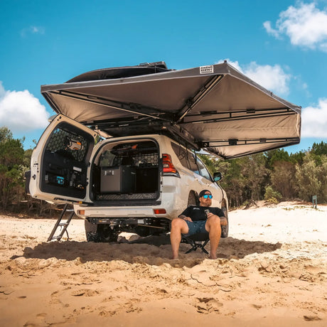 Outback Tourer Drivers Side 270 Plus Awning rear underside view over open rear door at the beach.